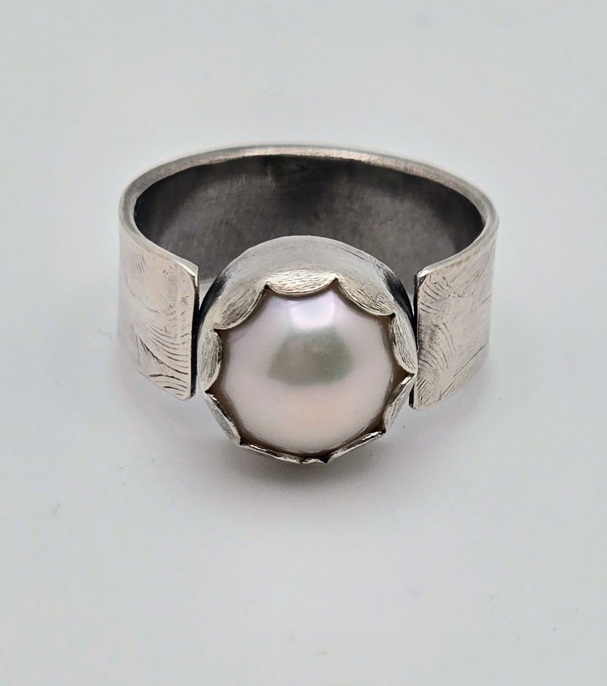 Pearl and embossed sterling silver ring
