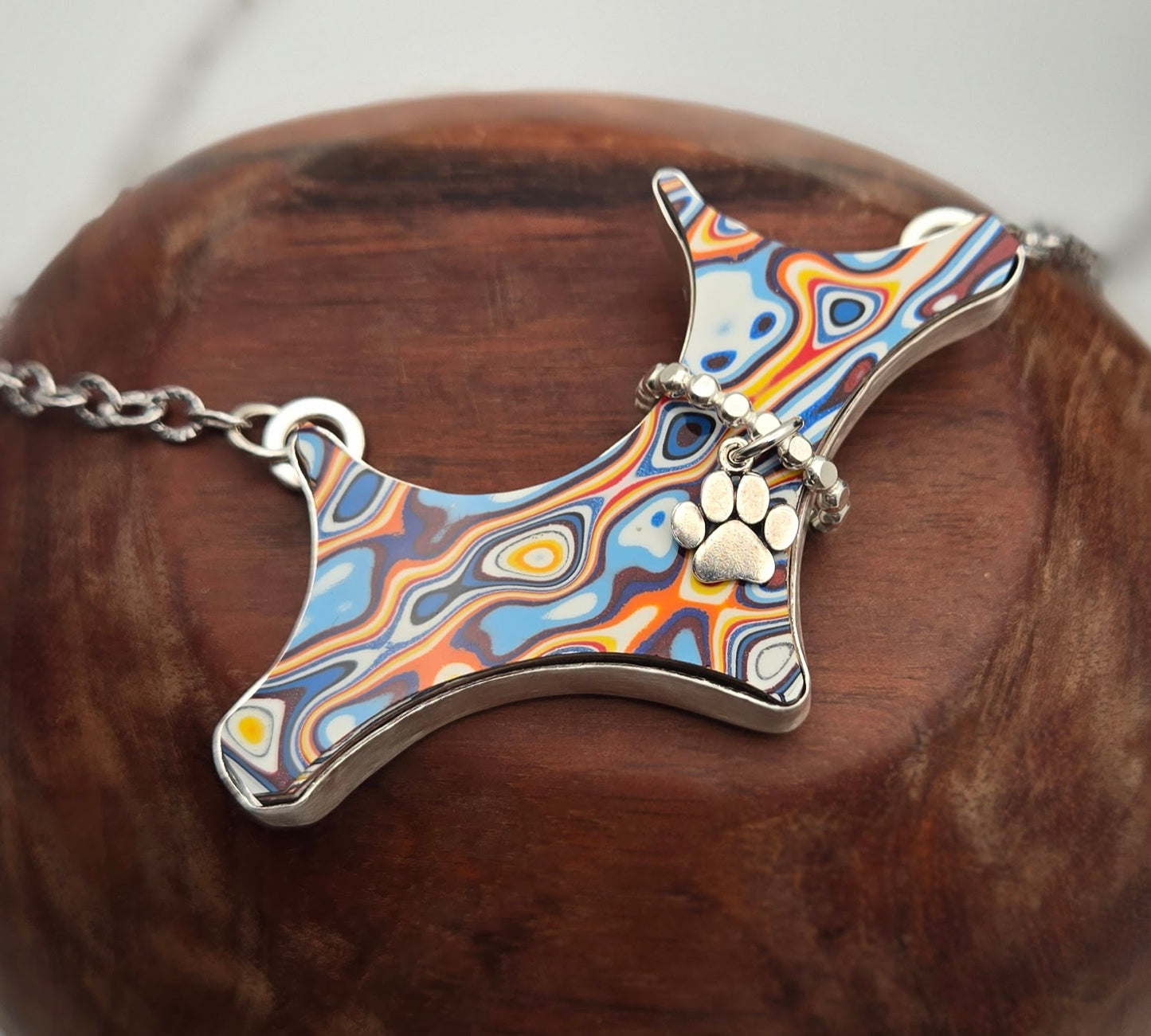 Felicia, the Fordite pup necklace