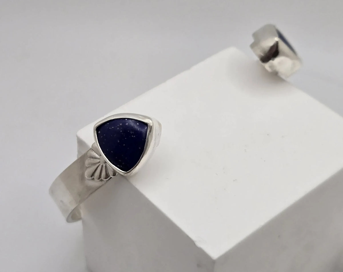 Blue Teapot Jewelry sterling silver cuff bracelet featuring triangular lapis lazuli stones with vintage detailing.